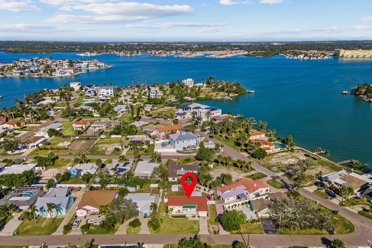 Aerial view over Redington Beach showing the barrier island between the Gulf and the inland water.